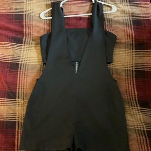 Black romper with cut outs on the sides/stomach